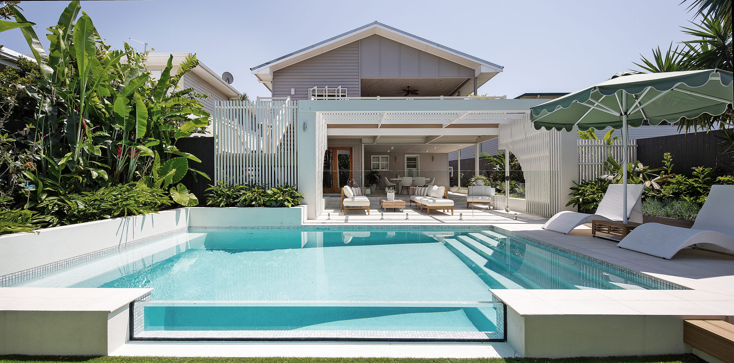 Pool pavilion and lawn in afternoon light